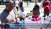 Relatives of victims of violence protest on Copacabana beach