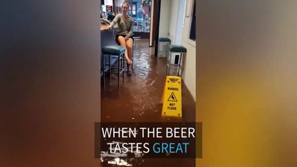 Australians refuse to leave flooded bar