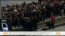 En gare de Lyon à Paris, les quais sont bondés et des usagers descendent sur les voies