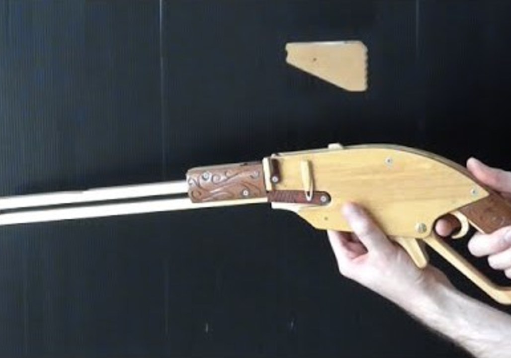 Man Demonstrates Clip-Ejecting Rubber Handgun