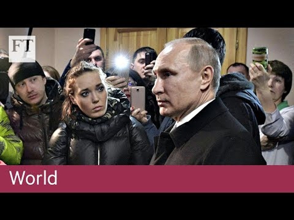 Putin visits mall fire scene amid protests