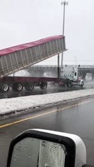Raised Truck Bed Slams into Overpass and Spills Seeds