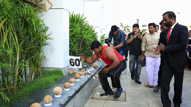 Most coconuts smashed in a minute! - Guinness World Records