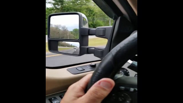 Woman drives stolen car with owner clinging to the hood