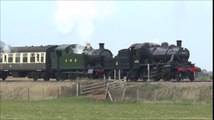2 Steam Locomotives Double Heading a Train of 6 Carriages towards a Seaside Railway Station in the UK