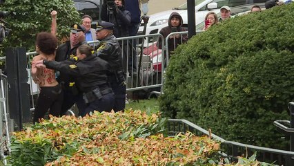 Protesters greet Bill Cosby as he arrives at court