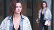 Selena Gomez leaves Pilates class carrying bible... as former flame Justin Bieber 'wants her back'.