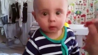 Cute baby saying no to raspberry in a funny way - I don't like it daddy :D