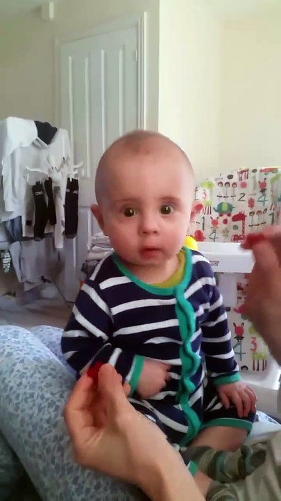 Cute baby saying no to raspberry in a funny way - I don't like it daddy :D