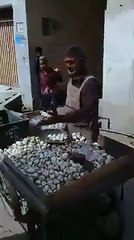 A Street Hawker Selling Garlic with a Unique Slogan