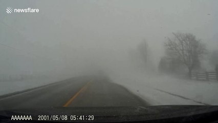 Dashcam captures truck nearly hitting van head-on during blinding snowstorm