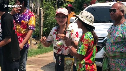 Villagers in rural Thailand celebrate country’s New Year