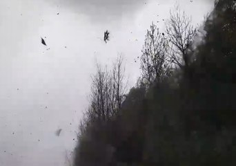 Vehicles Hit with Debris as Possible Tornado Passes Overhead