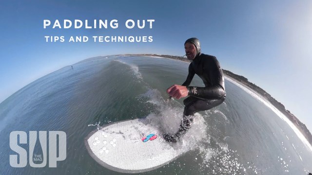Paddling out through surf