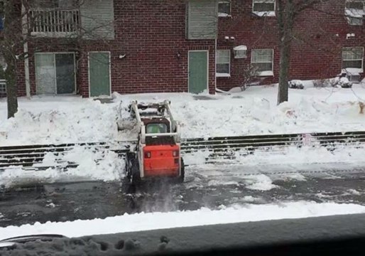 Snowplow Clears Road After Green Bay Blanketed by Heavy Snowfall