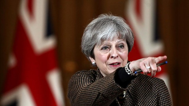 May tells Parliament UK acted in 'national interest' over Syria strikes
