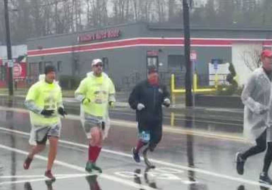 Boston Racers Brave the Weather for Chilly, Wet Marathon