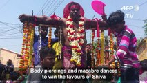 Devotees crucify themselves, dance with skulls at Hindu festival