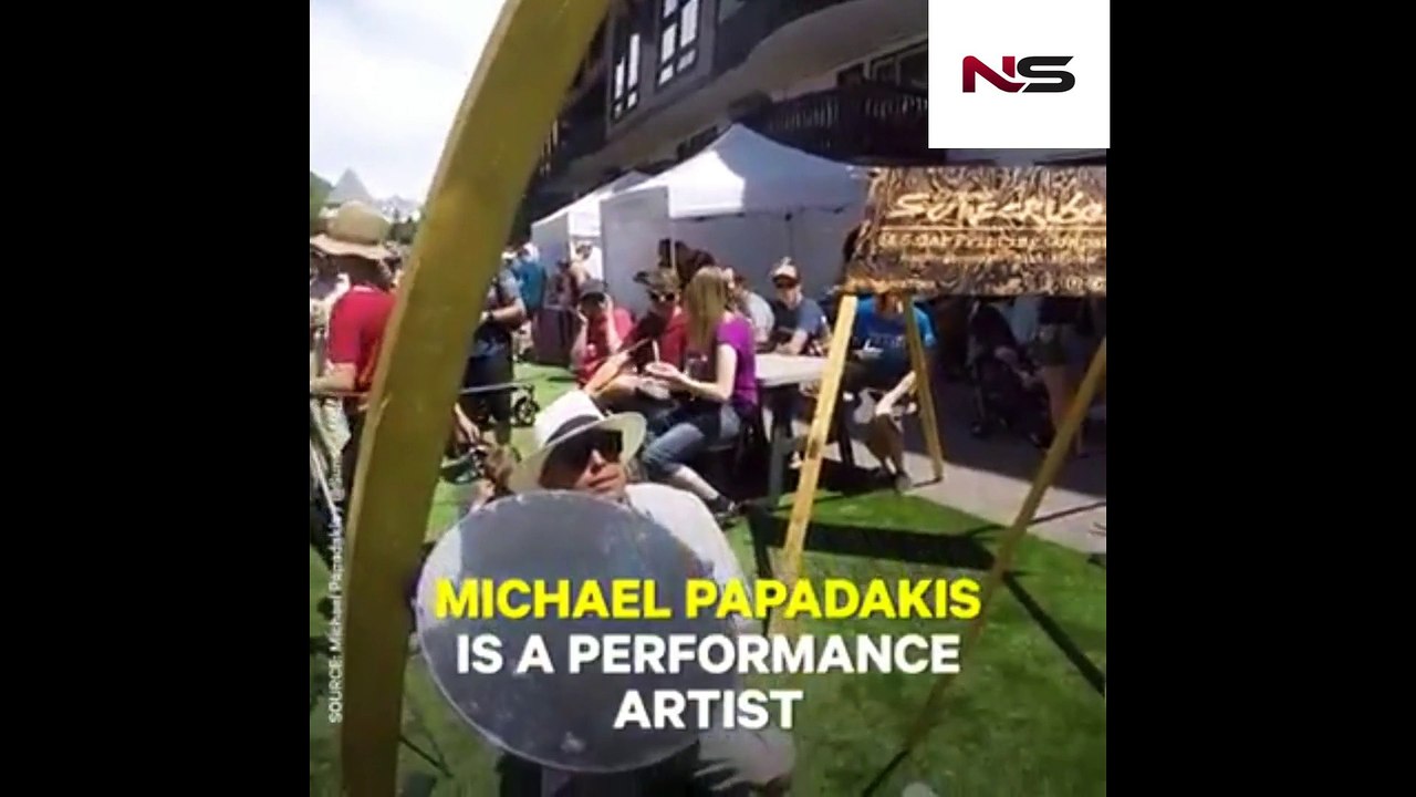 ARTIST PAINTS WITH SUN