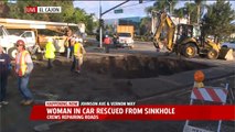 Woman Rescued After Car Falls Into Sinkhole