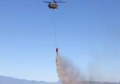 Helicopter Drops Water Over Wildfire in Colorado's El Paso County