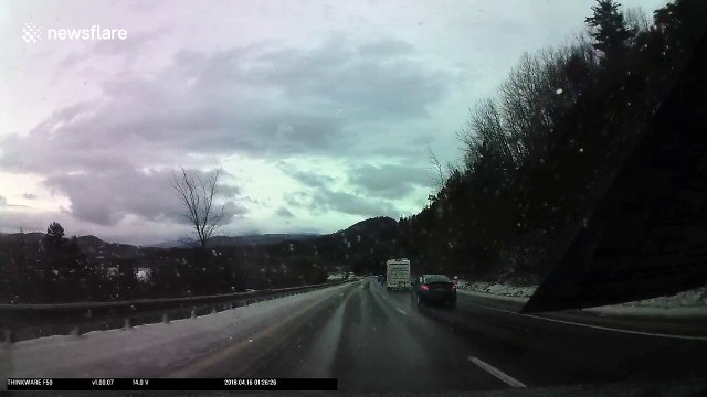 Dashcam video captures flying ice cracking car windshield