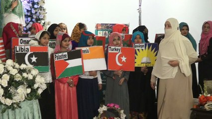 Kids performing on Stage with Holding Flags of Muslim