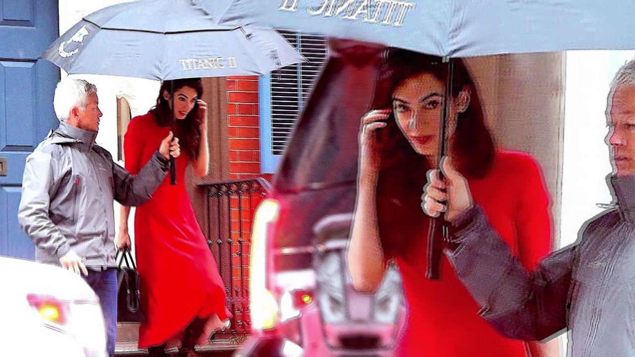 Amal Clooney grabs attention in scarlet red dress and lace-up heeled boots as she steps out in New York City