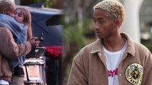 Jaden Smith takes time out of a PDA with girlfriend Odessa Adlon to check his phone.