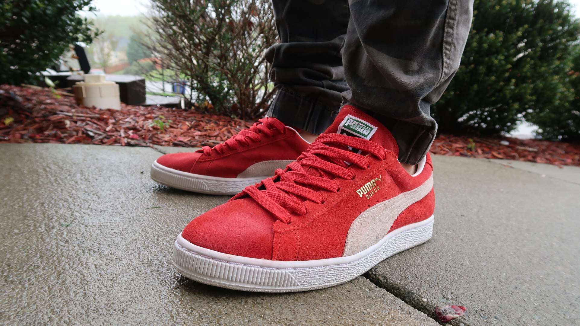 red puma suede on feet