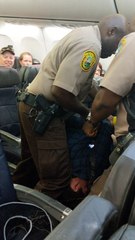 Plane Passenger Removed by Police