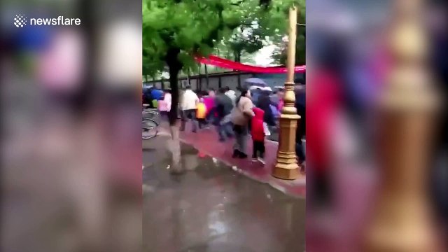 Parents surge over primary school gate as they rush for entrance interview