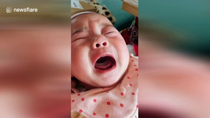Baby pretends to cry to get parents' attention
