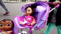 Little Girl Pushing Purple Stroller In Shopping Mall With Doc Mcstuffins Baby Cece