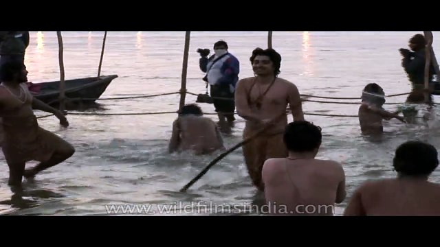Naga sadhus have a holy bath at Ardh Kumbh Mela