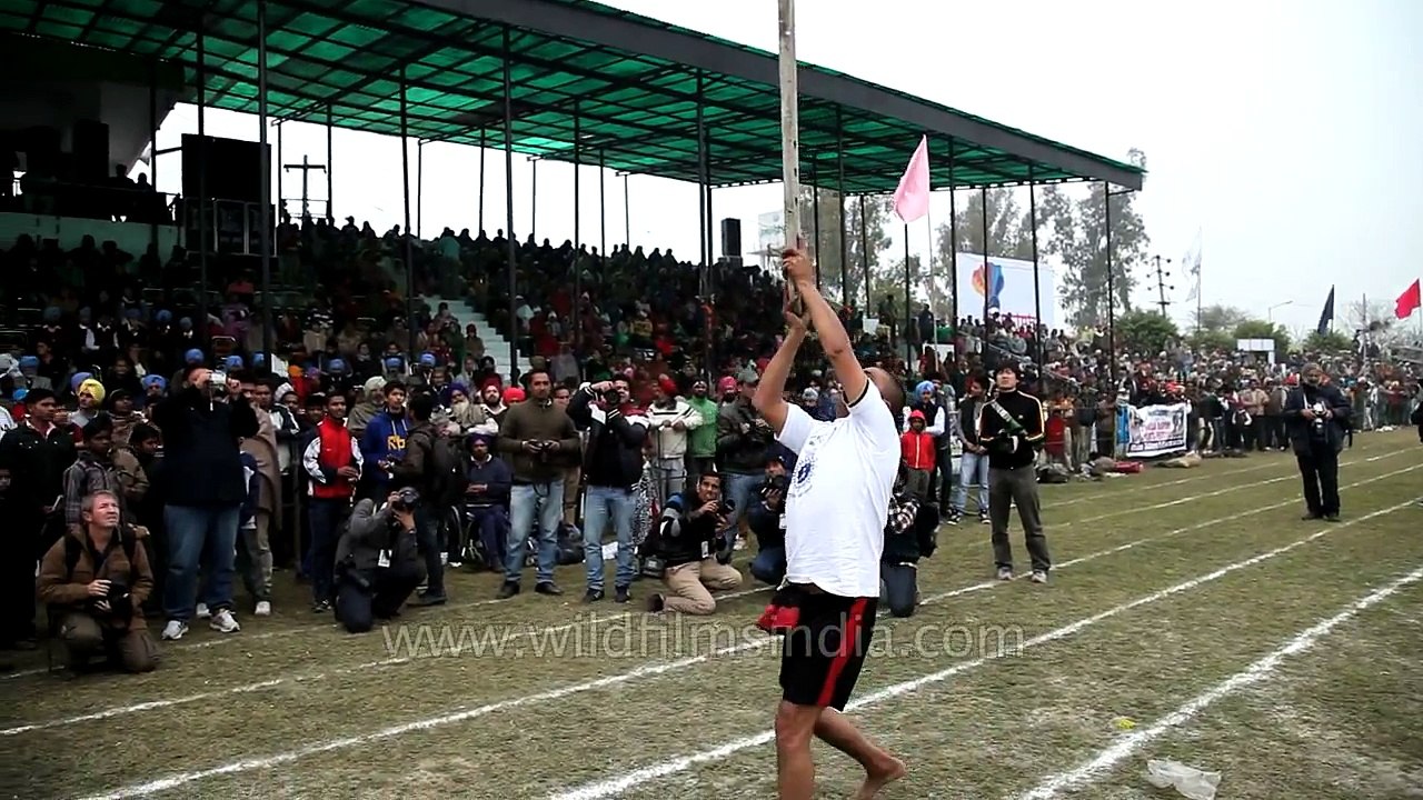 Plough lifting with teeth - happens only at Rural Olympics
