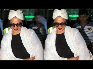 Rekha Spotted At Mumbai Airport, Trying To Hide Herself