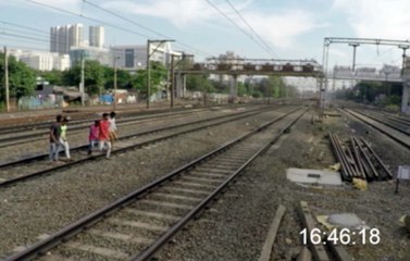 Friends Save Man with Foot Stuck in Train Tracks