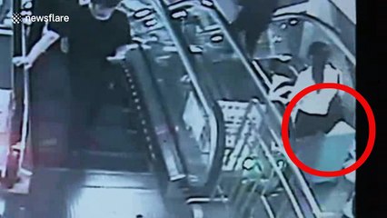 Runaway suitcase caught on video knocking down woman on escalator