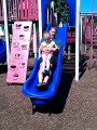 Emma Going Down The Side with her Dad at The Park.