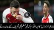 German Muslim footballer Mesut Ozil kisses bread thrown at him by Atletico Madrid fans