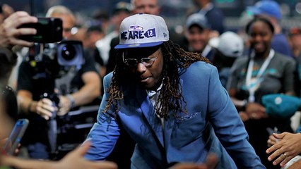 Shaquem Griffin is all smiles as he high-fives fans at AT&T Stadium