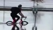 Bicyclist Navigates Floodwater Along St John River