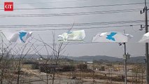 Banners and flags for the 2018 inter-Korean summit lead the way to the Unification Bridge. A map of the Korean Peninsula is displayed alongside the message 