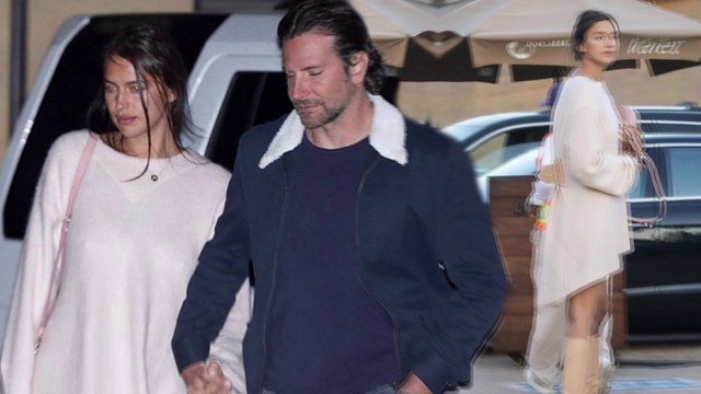 Irina Shayk glams up in chic cream dress as she arrives hand in hand with Bradley Cooper for Malibu dinner date.