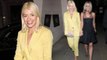 Holly Willoughby wows in plunging lemon suit as she holds hands with Nicole Appleton at glitzy opera gala.