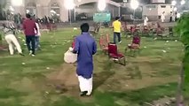 PTI Workers clearing the Jalsa Gah from different waste material after Minar-e-Pakstan Jalsa