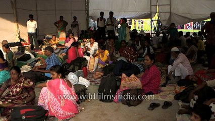 Crowd waits anxiously for the miracle process of fish remedy to begin