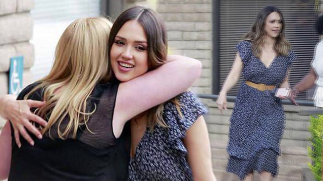 Jessica Alba looks chic in a patterned boho dress with a ruffled hem as she enjoys leisurely catch up with friends.