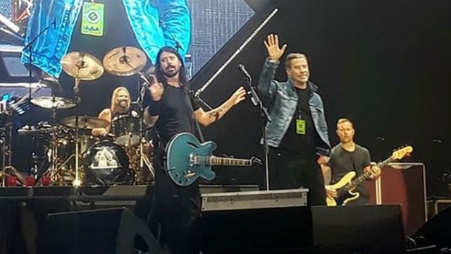 John Travolta joins Foo Fighters on stage during ‘Grease’